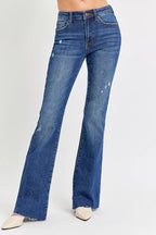 Distressed Mid Rise Flare Leg Jeans -